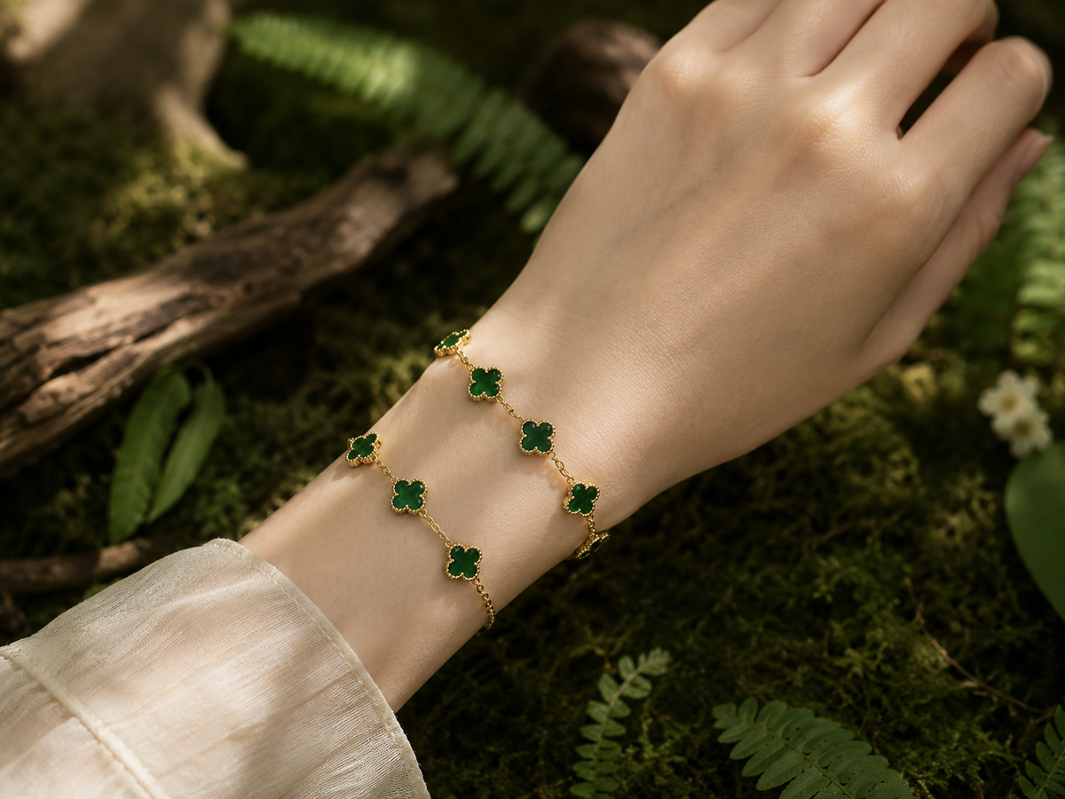 Green jade clover bracelet with five jade clover accents and gold-plated copper chain